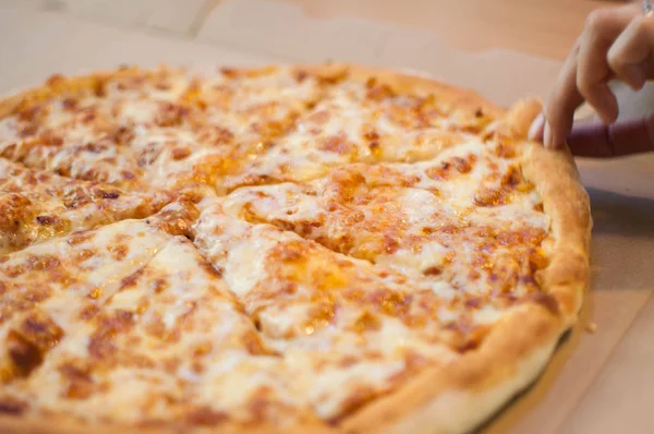 A whole four cheese pizza on a dining table — Stock Photo, Image