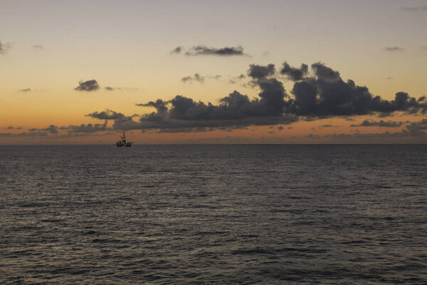 Sunrise over the oil towers and offshore oil rigs 