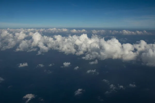 Beautiful clouds over the sea, Beautiful white clouds forming and moving in blue sky