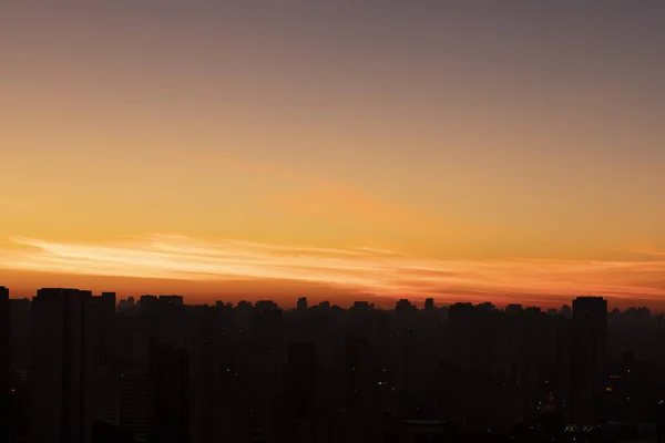 Big black city silhouette and sunset. Silhouette of the city of Sao Paulo, Brazil South America.