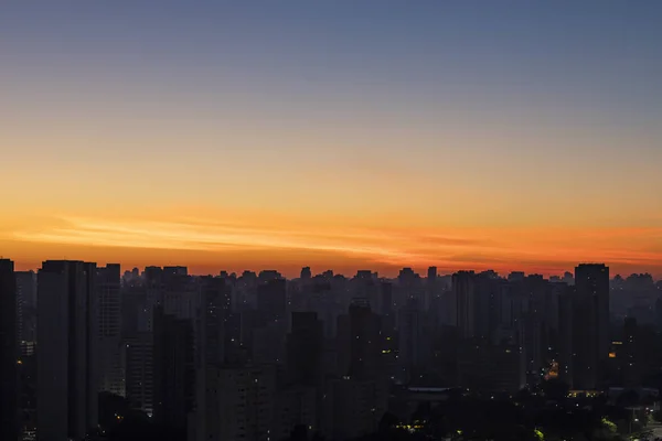 Big black city silhouette and sunset. Silhouette of the city of Sao Paulo, Brazil South America.