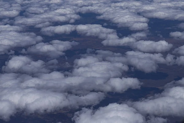 Flying above the clouds. View from the airplane, soft focus.