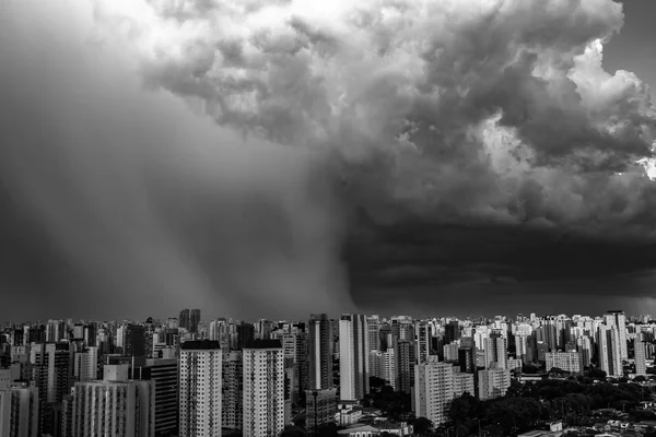 Beautiful view of the dramatic dark stormy sky in black and white. The rain is coming soon. Pattern of the clouds over city. Very heavy rain sky in Sao Paulo city, Brazil South America.