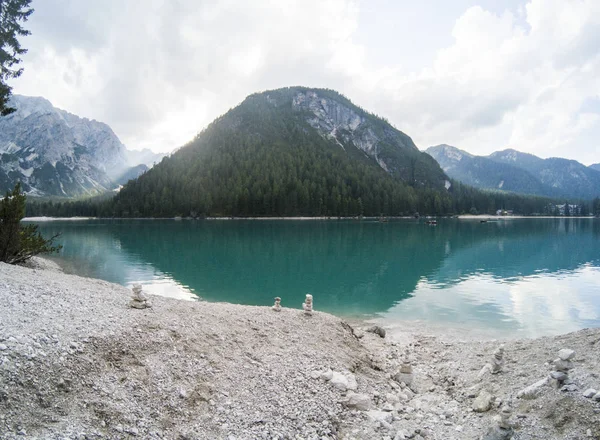 Amazing view of Braies Lake. Lago di Braies with summer forest and mountains reflected in surface lake water Dolomites Alps, Italy, Europe. Captured on Gopro hero 5 hero5. — Stock Photo, Image