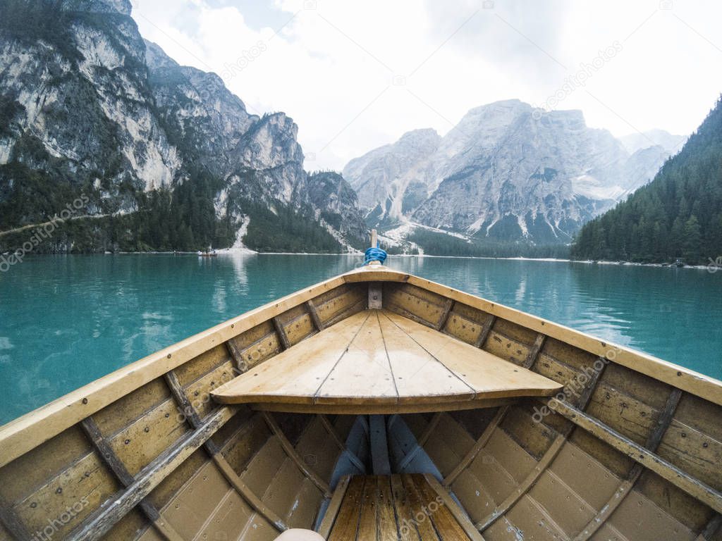 Nose of wooden boat at the alpine mountain lake. Lago di Braies, Dolomites Alps, Italy.