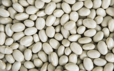 Beyaz fasulye arka plan ve bir doku olarak kapatın. Sağlıklı vejetaryen diyet yemek microelements içinde zengin. Sağlıklı yaşam tarzı yemek.