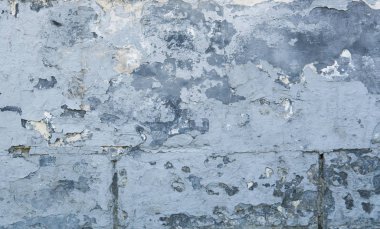 Mavi beton duvar doku çatlaklar. Çatlaklar, çizik, peeling eski boya ve sıva arka plan üzerinde eski duvar çimento. Bir çimento taş duvar eski vintage kırık olarak.