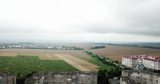 Aerial view of town with socialist soviet style of building at cloudy day. Buildings were built in the Soviet Union. The architecture looks like most post-soviet commuter towns. — Stock Video