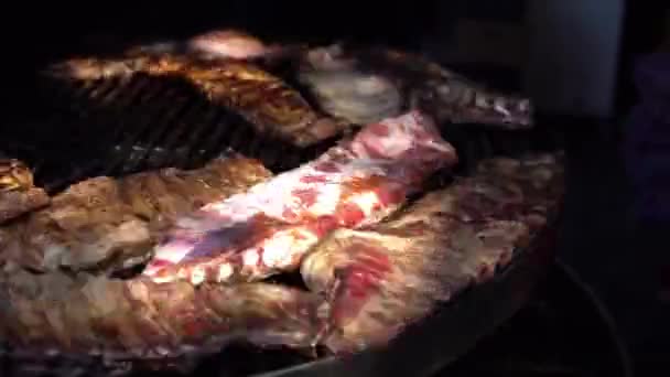 Pork Side Ribs Cooking On A Large BBQ Outdoors At A food fest. — Stock Video