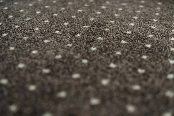 Karpet cokelat dengan tekstur titik-titik putih. Syuting karpet dalam ruangan di siang hari . — Stok Foto