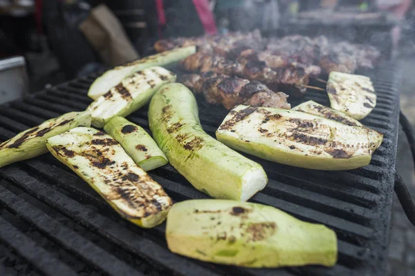 Zucchini and meat shish cooking on a grill. — Stock Photo, Image