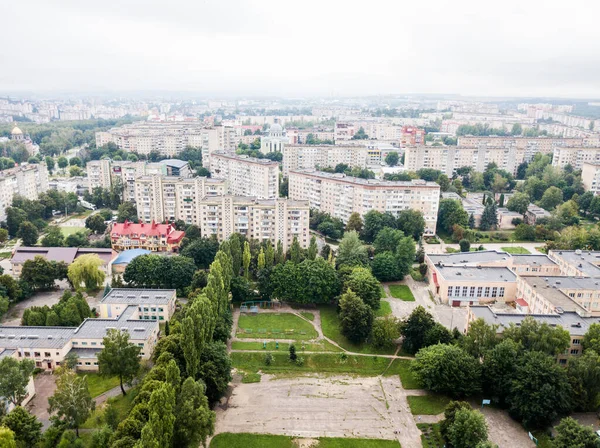 Aerial view of town with socialist soviet panel building at cloudy day. Buildings were built in the Soviet Union now Ukraine. The architecture looks like most post-soviet commuter towns. — Stock Photo, Image