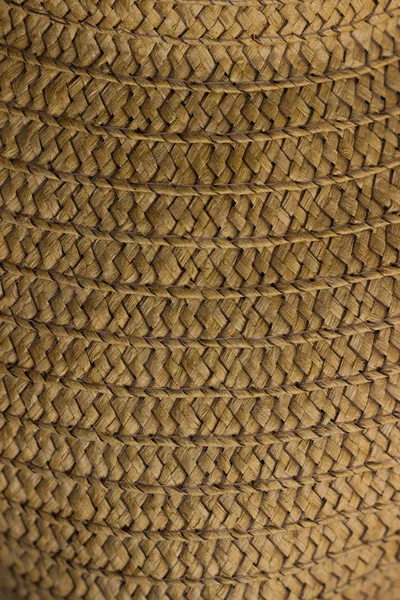 Texture of straw hat close up. Straw hat, close up detail.