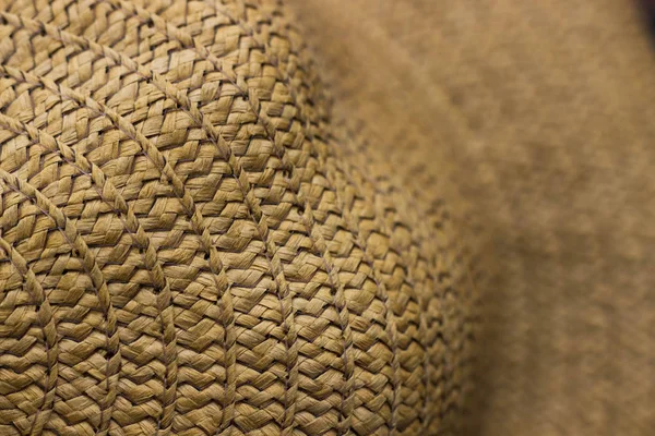 Texture of straw hat close up. Straw hat, close up detail.