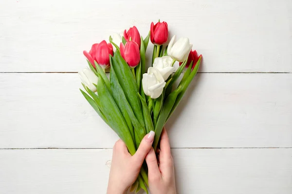 Bouquet Tulips Womans Hands White Wooden Background Greeting Card International — Stock Photo, Image