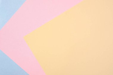 Pastel kağıt renk arka plan, farklı renklerde karton çok renkli arka plan, renkli soyut geometrik şekiller. Pastel renkli kağıt doku minimalizm arka plan. Mavi, pembe, sarı.