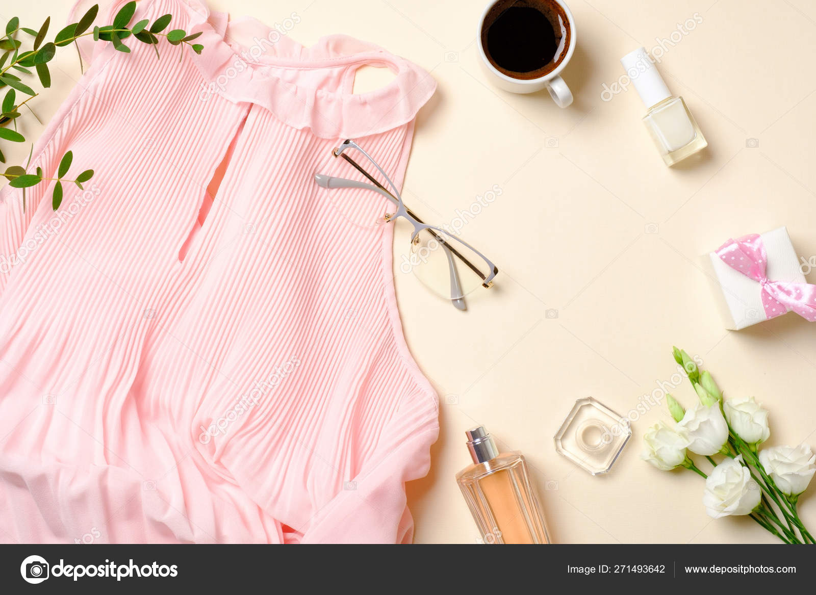 Flat lay feminine accessories, perfume bottle, roses flowers, dress, glasses, coffee cup, gift box. Top view beauty blogger with female clothes and cosmetic. Fashion blog banner. Stock Photo ©