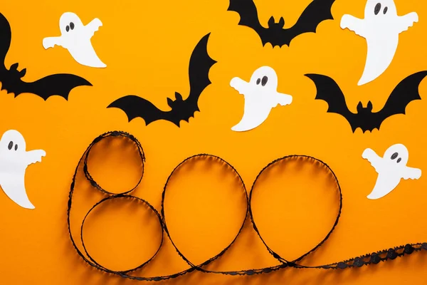 Halloween holiday concept. Halloween decorations, ghosts, bats, \