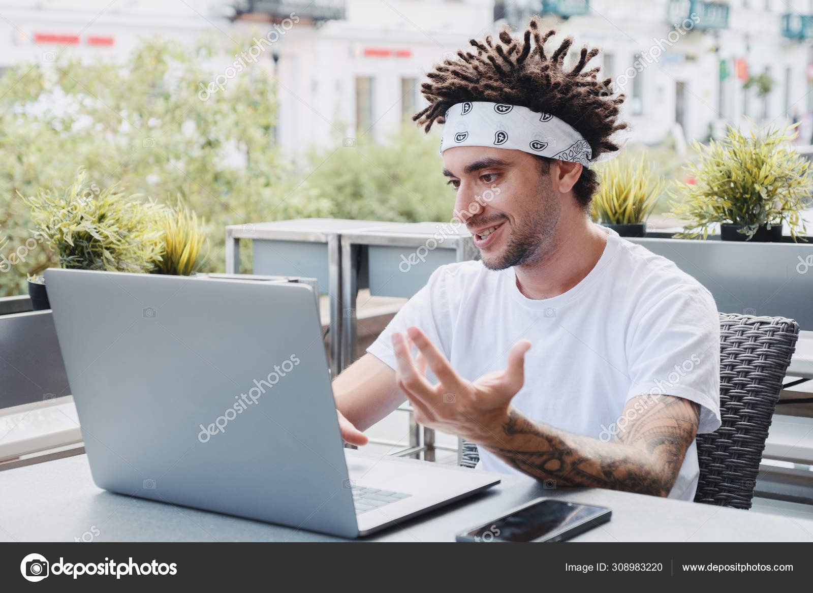 Happy Bearded Hipster Guy Waving Hand And Talking On Video Chat Using Wireless Network On Laptop Device Handsome Man With Dreadlocks Hairstyle Vlogging Talking On Web Camera On Notebook Stock Photo Happy Bearded Hipster Guy Waving Hand And Talking On Video Chat Using Wireless Network On Laptop Device Handsome Man With Dreadlocks Hairstyle Vlogging Talking On Web Camera On Notebook Stock Photo