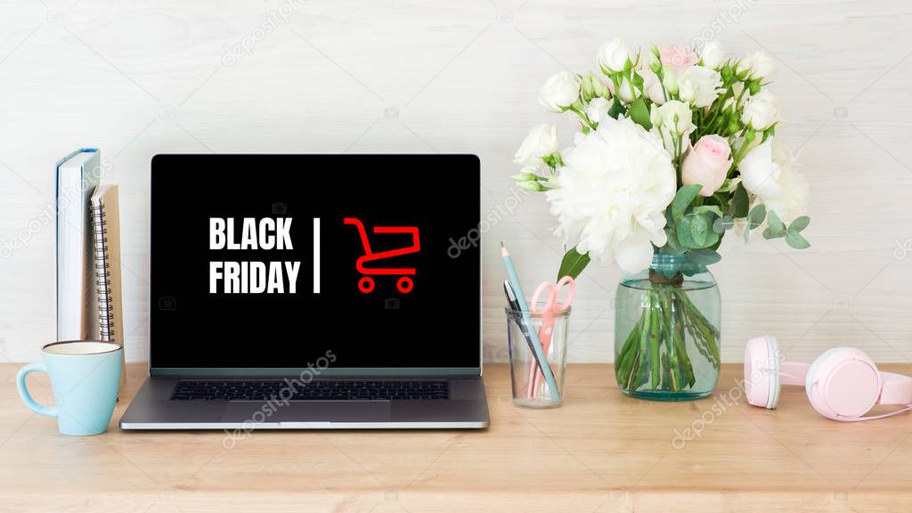 Black Friday concept. Laptop screen with text sign 