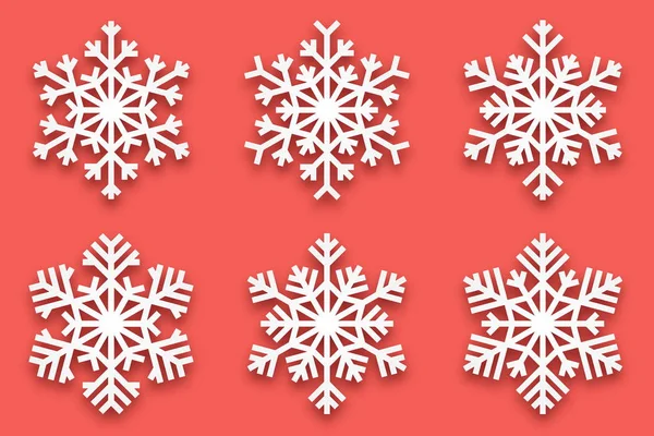 ベクトル Papercut 装飾的な手作りの雪は 背景が薄い赤に分離ソフト ドロップ シャドウを設定します メリー クリスマスと幸せな新年の装飾デザイン要素 — ストックベクタ