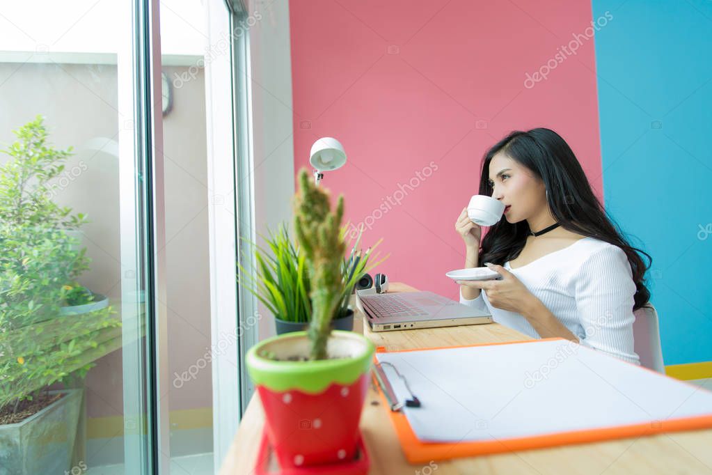 young beautiful working at computer desk