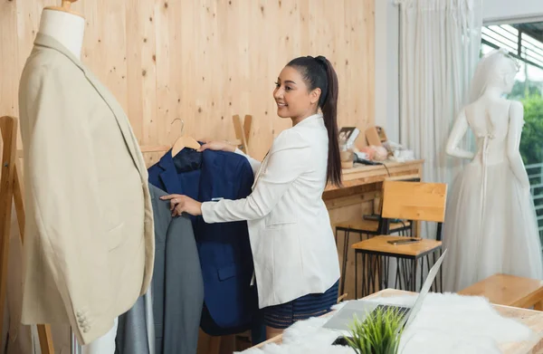 woman business owner working in her tailor shop