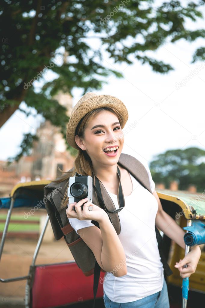 Young asian female traveler with backpack traveling Ayutthaya Pr