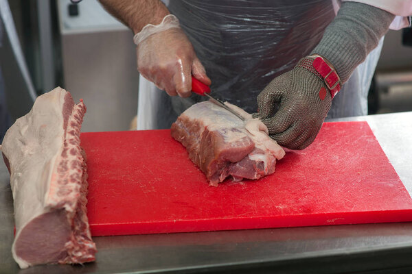 cutting meat in the meat shop