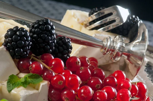 still life with soft cheese and berries