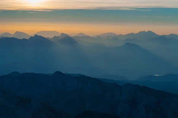 Layers of mountain ranges and hills at sunrise in Slovenia