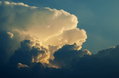 Dramatic formation of thunderstorm towering cumulonimbus clouds rising in blue sky, Cumulus congestus clipart