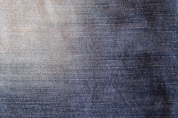 Used faded blue jeans, denim jeans background. Jeans texture, fabric. — Stock Photo, Image