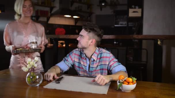 Young Woman Bathrobe Prepared Breakfast Boyfriend Carries Food Tray Puts — Stock Video