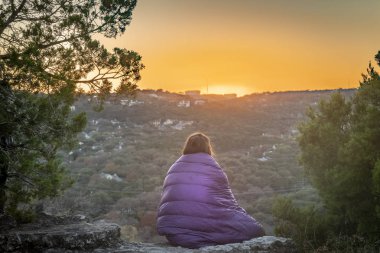 Catching Sunset in Austin, Texas at Mount Bonnell overlooking the river clipart