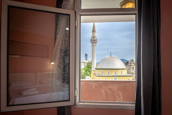 Looking at a mosque through a window