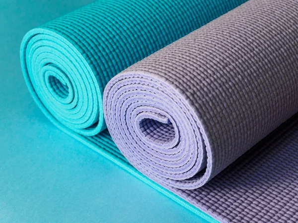 Two mats for yoga, fitness or Pilates. Blue and purple Mat.