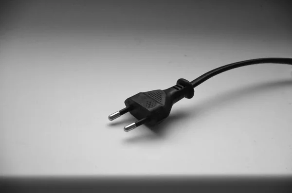 Black power cable with plug and socket isolated on white