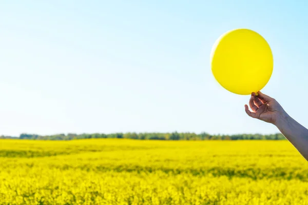 yellow balloon, feel good and glad in Blue Sky background. sign of emotion. image for background, wallpaper. copy space