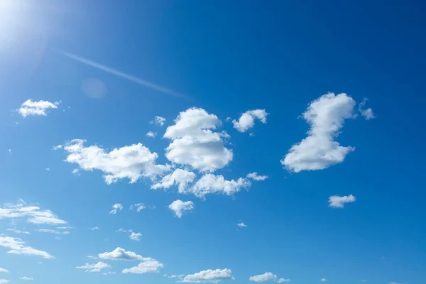 Scattered cloud clusters in a blue sky. Blue sky background with clouds