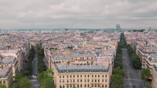 Panoramic view from above, on the roofs of the old district and the Montmartre district of Paris, France Slow Motion. Cityscape cars on the road. Shot from the arch of triumph — Stock Video