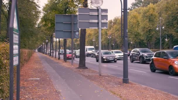BERLIN, GERMANY - OCTOBER 02, 2018. Slow Motion Autumn street in the center of the capital. Cars drive past the camera — Stock Video