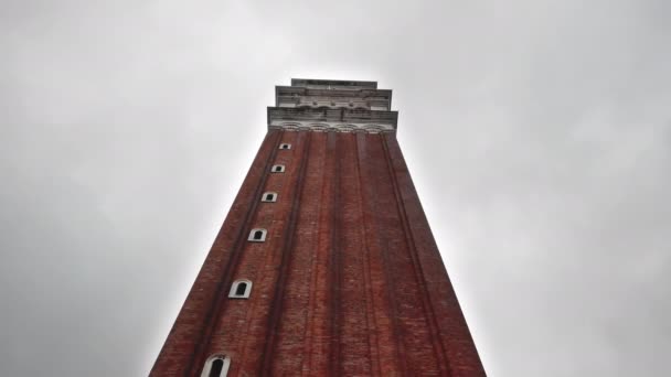 VENICE, Italy - May 2019: face of the Campanile seen from the Piazza San Marco. Rainy autumn weather. slow motion. — Stock Video