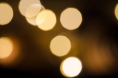 Soyut sarı bokeh. Noel ve mutlu yeni yıl kutlama ve diğer arka plan. Zemin ve sunum için arka plan.