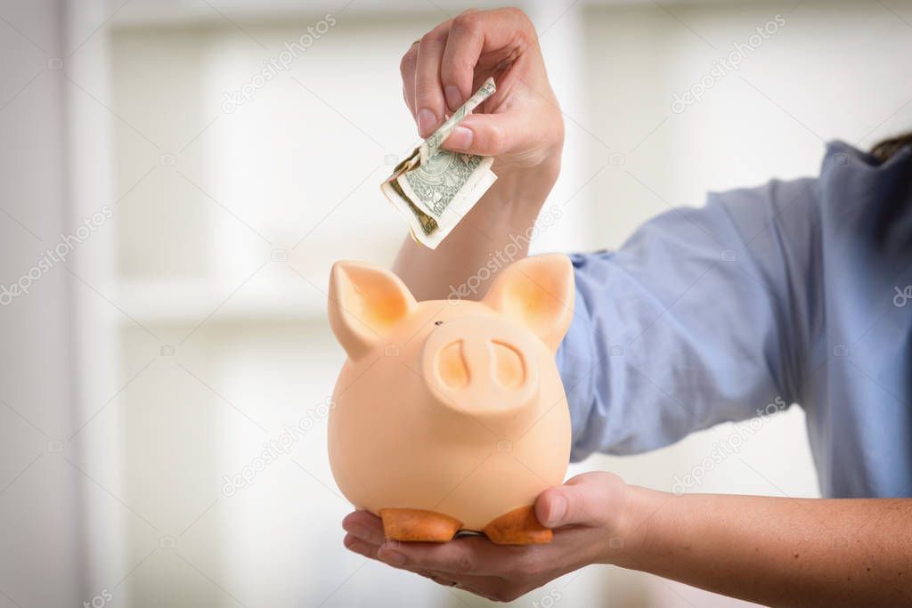 Saving money in the piggybank