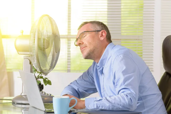 Man Suffers Heat While Working Office Tries Cool Fan — Stock Photo, Image