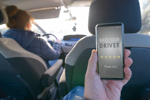 Passenger Sitting Back Seat Car Using Smart Phone App Rate — Stock Photo, Image