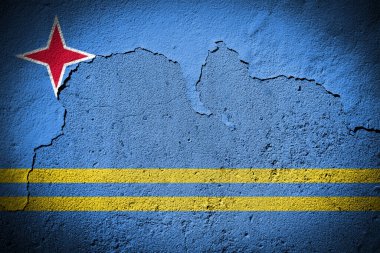 Çatlak duvarda Aruba bayrağı var.