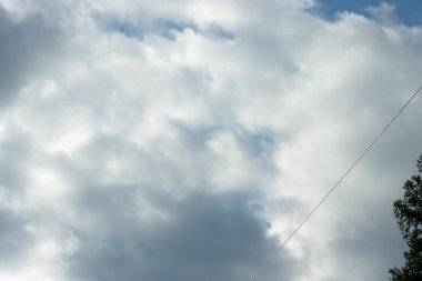 a low-angle shot of a white cloudy background