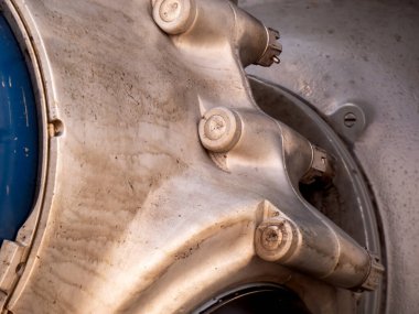 close up of an oil-streaked propeller hub on an aircraft engine